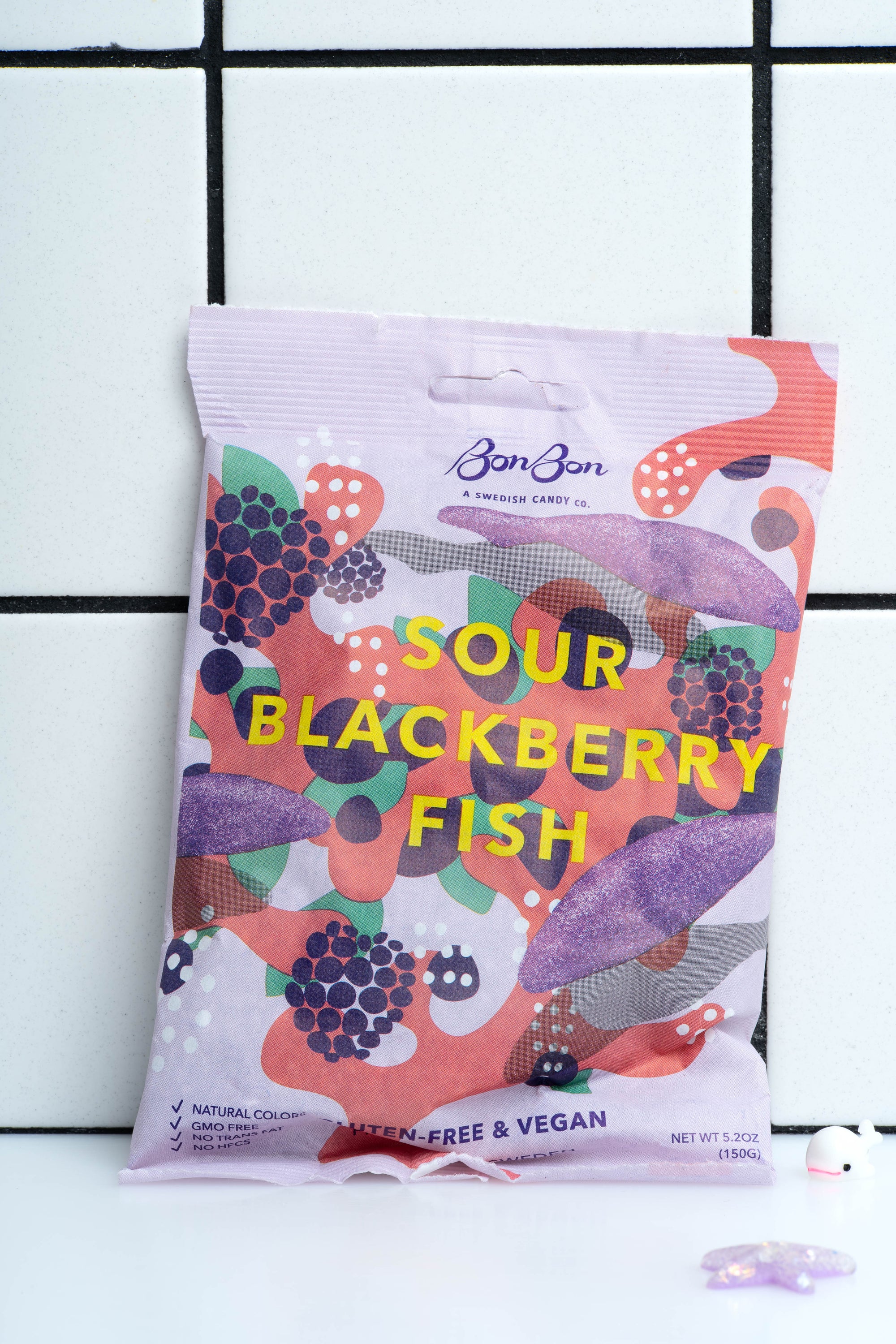 
    
        Sour Blackberry Swedish Fish packaged in a lavender bag with yellow text.
    
  